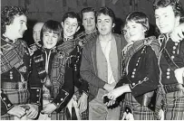  ??  ?? Tribute: Paul McCartney and the Campbeltow­n Pipe Band topped the charts with Wings’ Mull Of Kintyre