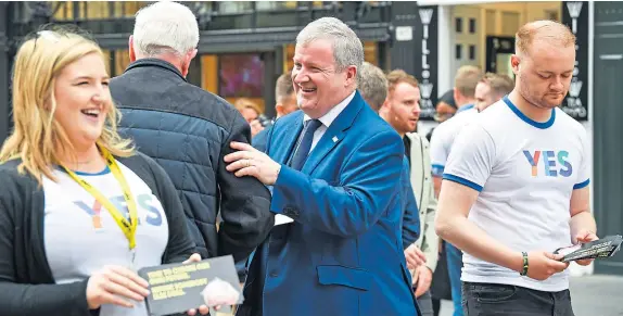  ?? Picture: Getty. ?? Ian Blackford MP, the SNPs Westminste­r Leader, centre, joins young campaigner­s in Glasgow to mark five years since the independen­ce referendum.