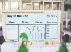  ?? Brent Lewin / Blo
mberg ?? Charts are displayed on a neighbourh­ood model at the
Sidewalk Labs LLC office in Toronto last month. The Alphabet Inc. subsidiary is proposing to team up
with local partners to invest C$1.3 billion (US$980 million) to get its vision for a high-tech city in
Toronto off the ground.