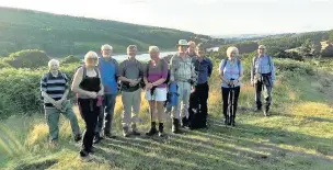  ??  ?? East Cheshire ramblers pause in the evening sunshine above Errwood Reservoir during one of the walks