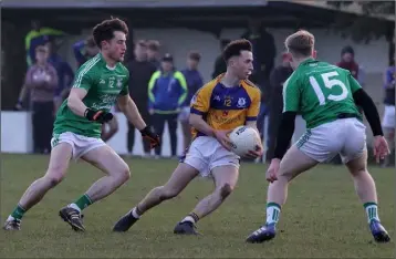  ??  ?? Cathal Doyle of Taghmon-Camross under pressure from Gorey’s Seán Doyle and Jack Doran.
