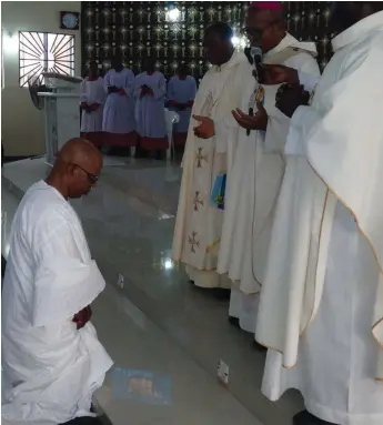  ??  ?? The Imo CP Lakanu (left) receiving prayers from the Catholic Archbishop of Owerri Ecclesiast­ical Province, His Grace, Most Rev. Dr. A.J.V. Obinna