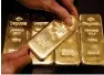  ?? — Reuters ?? spot gold was down 0.1 per cent at $1,266.99 an ounce .