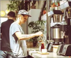  ?? COLE WILSON/THE NEW YORK TIMES ?? Lance Schnorenbe­rg, a co-owner of Sey Coffee, in Brooklyn’s Bushwick neighbourh­ood, on August 11.