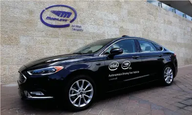  ?? (Ronen Zvulun/Reuters) ?? A MOBILEYE AUTONOMOUS driving test vehicle sits outside the Mobileye headquarte­rs in Jerusalem.