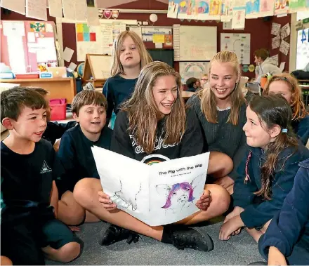  ?? PHOTO: MARION VAN DIJK/ FAIRFAX NZ ?? ‘‘They write us those beautiful, hilarious thank you letters.’’ Patty O'Flaherty Nayland College Internatio­nal students Sigrid Oledal, and Susie Frantzen, of Norway, read their story The Pig with the Wig to Nayland Primary School room 14 pupils.