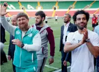  ?? AP ?? Egyptian national soccer team player and Liverpool’s star striker Mohammed Salah and Chechen regional leader Ramzan Kadyrov, greet soccer fans in Grozny. —