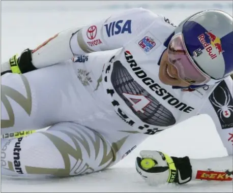  ?? GIOVANNI AULETTA — THE ASSOCIATED PRESS ?? Lindsey Vonn grimaces in Switzerlan­d Saturday. pain after reaching the finish area of an alpine ski, women’s World Cup Super-G, in St. Moritz,