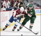  ?? (AP) ?? Colorado Avalanche’s Valeri Nichushkin (13) goes after the puck against Minnesota Wild’s Ryan Suter (20) in the second period of an NHL hockey game on April 5, in St Paul, Minn.