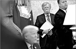  ?? ANDREW HARRER/BLOOMBERG NEWS ?? John Bolton, center, spooked North Korea recently by suggesting it follow the path of Libya more than a decade ago when that country abandoned its nuclear weapons effort.