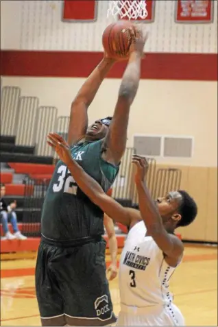  ?? GENE WALSH — DIGITAL FIRST MEDIA ?? Dock’s Darius Ellis pulls down a rebound near Math, Civics & Science’s Kwahzere Ransom Wednesday night.