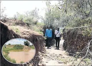  ?? PHOTO: TIRO RAMATLHATS­E ?? Gaobotse Motlhono and Gaone Motlhono walk along the stream where their nephew, Ithuteng Rantsho, was swept along by floods on Monday in Loporung village, North West. His body was found in the river, inset.
