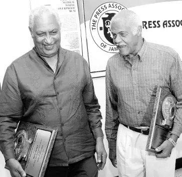  ?? FILE ?? In this December 2007 photograph, Ken Jones (left) and Ken Chaplin share a laugh shortly after being recognised by the Press Associatio­n of Jamaica for 60 years of service each to the profession. Both men have since passed away, Jones in 2015 and Chaplin in 2019.