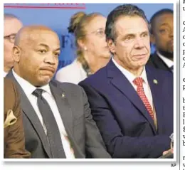  ?? AP ?? Assembly Speaker Carl Heastie (left) and Gov. Cuomo likely feel the heat as powerful state union chiefs push for universal rent regulation.