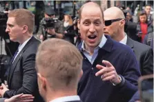  ?? CZAREK SOKOLOWSKI/AP ?? Britain's Prince William arrives at a food market Thursday to meet with groups of young Ukrainian refugees, who have settled in Warsaw, Poland.