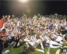  ?? ALONZO ADAMS/FOR THE OKLAHOMAN ?? Bixby poses for a photo after defeating Choctaw during the OSSAA Class 6A-II football title game at Wantland Stadium in Edmond last Dec. 5.