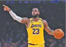  ?? AP FILE PHOTO/MARK J. TERRILL ?? Los Angeles Lakers forward LeBron James is the AP’s male athlete of the year for 2020, his fourth time receiving the honor. That ties the record held by Lance Armstrong and Tiger Woods.