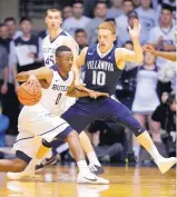  ?? MICHAEL CONROY/ASSOCIATED PRESS ?? Butler guard Avery Woodson (0) drives on Villanova guard Donte DiVincenzo (10) in the first half of Wednesday night’s game. The Bulldogs won 66-58.