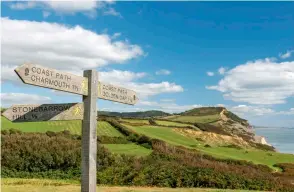  ?? ?? RUNNING UP THAT HILL
This is the location of Britain’s most southerly fell race, the Charmouth Challenge: a gruelling slog over Golden Cap.