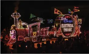  ?? DON KELSEN/LOS ANGELES TIMES FILE PHOTOGRAPH ?? The dazzling and colorful “Disney’s Electrical Parade” in 2001. The 45-year-old nighttime parade returns to Disneyland in Anaheim on Jan. 20, 2017, after an extended run at Florida’s Magic Kingdom theme park.