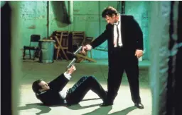  ??  ?? Mr. Pink (Steve Buscemi, left) and Mr. White (Harvey Keitel) share a tense moment in “Reservoir Dogs.”