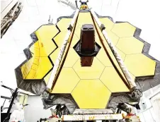  ?? ?? The primary mirror of NASA’s James Webb Space Telescope inside a clean room.