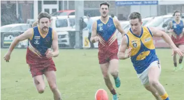  ??  ?? The recent win over Ellinbank has restored confidence in premiershi­p ambitions for Warragul Industrial­s. Pictured in the race for the ball is Josh Seri, who has been a handy addition to an already dynamic midfield.