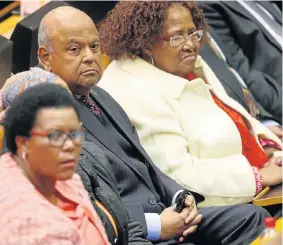  ?? Pictures: REUTERS ?? LENDING AN EAR: Former finance minister Pravin Gordhan listens to Speaker Baleka Mbete before the vote