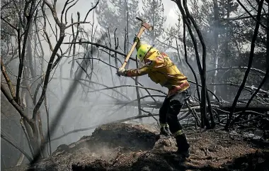  ?? CHAD SHARMAN/ NZDF ?? Defence Force firefighte­rs have been working with crews from Fire and Emergency NZ and the Department of Conservati­on at Redwood Valley since Thursday.