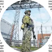  ?? ?? A Russian serviceman guards an area of the Zaporizhzh­ia Nuclear Power Station.