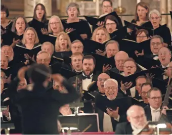  ?? JONATHAN KIRN / MSO ?? The Milwaukee Symphony Chorus sings Mozart’s “Requiem” on Friday at the Basilica of Saint Josaphat. The concert will be repeated Sunday.