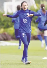  ?? Kirsty Wiggleswor­th / Associated Press ?? U.S. player Christen Press, left, stretches during a training session at the Tottenham Hotspur training centre in London on June 6.