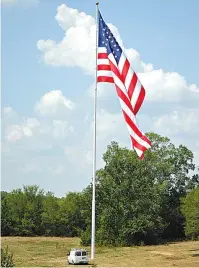  ?? The Sentinel-Record/File photo ?? Q Alliance Rubber Co.’s American flag is shown from the on-ramp from Carpenter Dam Road to the King Expressway in 2015.