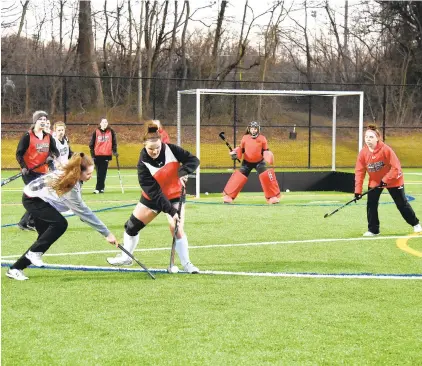  ?? PAUL W.
GILLESPIE/CAPITAL GAZETTE ?? The Crofton High junior varsity field hockey team, pictured running drills on the first day of practice Feb. 17, went undefeated in its first season.