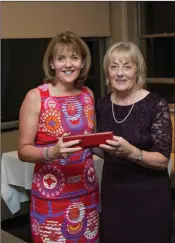  ??  ?? Martina Kelly, a winner in the Lady President’s prize competitio­n at Blainroe Golf Club, receives her prize from Lady President Bernie Nelson.