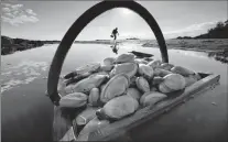  ?? AP FILE PHOTO ?? A basket of clams sits in the water at Cape Porpoise in Kennebunkp­ort, Maine.