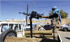  ??  ?? A Yemeni soldier outside UN offices during an anti-war rally in Sana’a. The Senate called for an end to US military support for Riyadh in the war. Photograph: Yahya Arhab/EPA