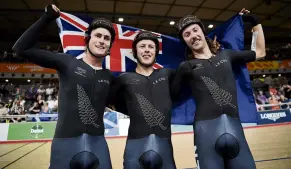  ?? PHOTO: GETTY IMAGES ?? By name and nature . . . New Zealander Corbin Strong (centre) celebrates with teammates Campbell Stewart (left) and George Jackson after winning the gold medal in the the men’s 15km scratch race in London yesterday.