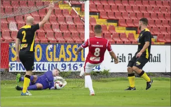  ??  ?? Mikey Drennan tries to score with Ciaran Kelly, Alan Keane and Gavin Peers attempting to stop him.