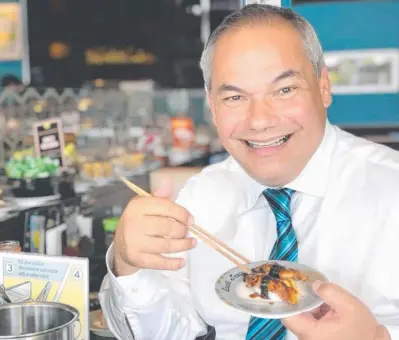  ?? Picture: FACEBOOK ?? Gold Coast Mayor Tom Tate pictured “doing (his) bit for the swans” by eating eel for lunch at Sushi Train in Southport yesterday.