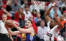  ?? RAY CHAVEZ/TRIBUNE NEWS SERVICE ?? The Warriors' Klay Thompson (11) makes a shot against the Trail Blazers' Maurice Harkless on Saturday.