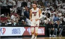  ?? WILFREDO LEE — THE ASSOCIATED PRESS ?? Miami Heat guard Max Strus (31) celebrates after scoring a three-point shot during the first half of Game 5of an NBA basketball second-round playoff series against the Philadelph­ia 76ers, Tuesday in Miami.