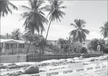  ??  ?? Workers at Triumph, East Coast Demerara, executing work on the ECD road widening project.