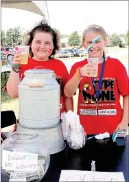  ?? LYNN KUTTER ENTERPRISE-LEADER ?? Addison Alford, left, and her friend Emily Henson set up a lemonade stand with donations going to the Juvenile Diabetes Research Foundation. Addison deals with her own medical problems but Saturday, she was helping her classmates who have Type 1 diabetes.