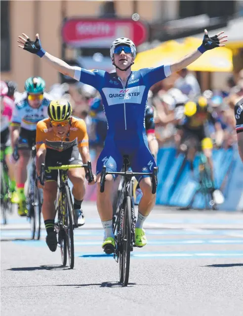  ?? Picture: AAP IMAGE ?? BIG MOMENT: Italian rider Elia Viviani of team Quick-Step celebrates winning stage three of the Tour Down Under from Glenelg to Victor Harbor, South Australia, yesterday.