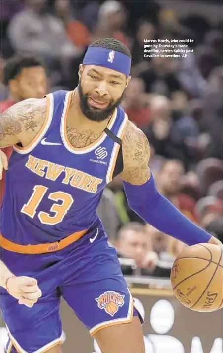  ?? AP ?? Marcus Morris, who could be gone by Thursday’s trade deadline, carries Knicks past Cavaliers in overtime.