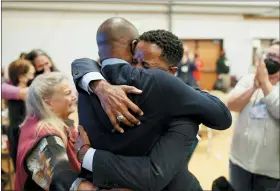  ?? PATRICK SCRIVEN/UNITED METHODIST NEWS VIA THE ASSOCIATED PRESS ?? Bishop Cedrick Bridgefort­h, a United Methodist elder in the California-Pacific Conference, embraces his husband, Christophe­r Hucks-Ortiz, after his election was announced Nov. 4 at Christ United Methodist Church in Salt Lake City.