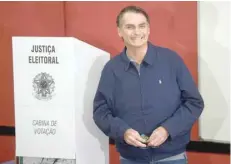  ?? — AFP ?? Right-wing presidenti­al candidate for the Social Liberal Party Jair Bolsonaro after casting his vote during general elections, in Rio de Janeiro, on Sunday.