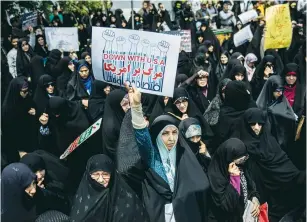  ?? ( Tasnim News Agency/ Reuters) ?? IRANIAN WOMEN in Tehran protest in May against US President Donald Trump’s decision to pull out of the 2015 nuclear deal.