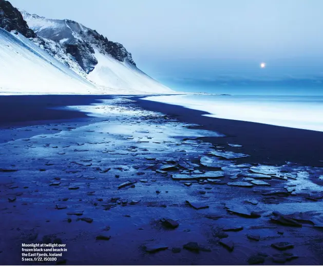  ??  ?? Moonlight at twilight over frozen black sand beach in the East Fjords, Iceland 5 secs, f/22, ISO100